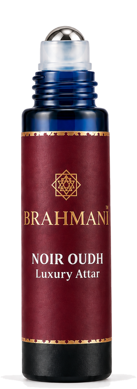 The Brahmani Noir Oudh attar bottle with its cap lifted away, showing the steel roller ball