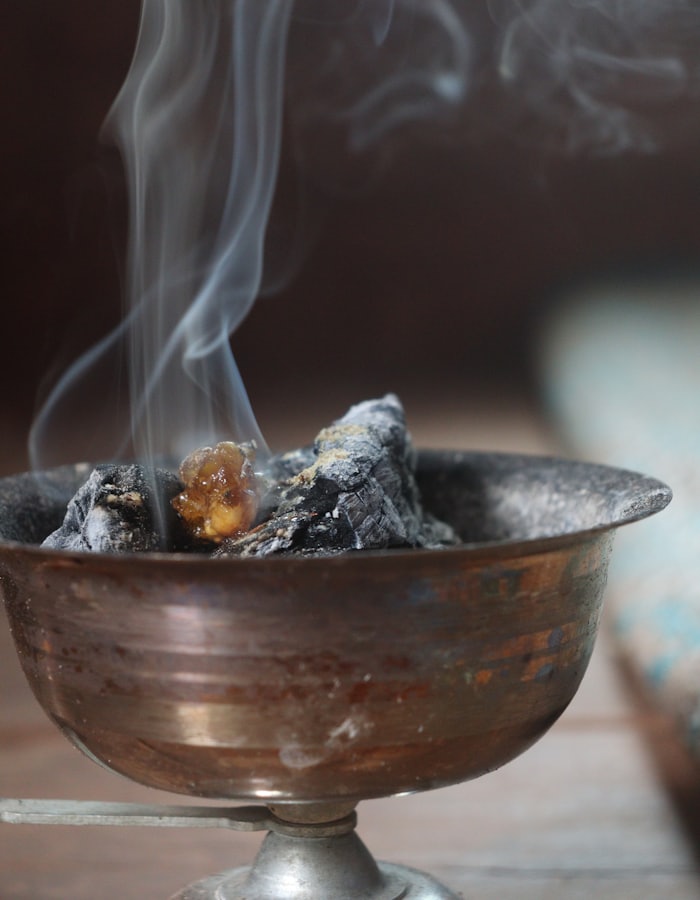 Loban resin smouldering in an antique brass censer